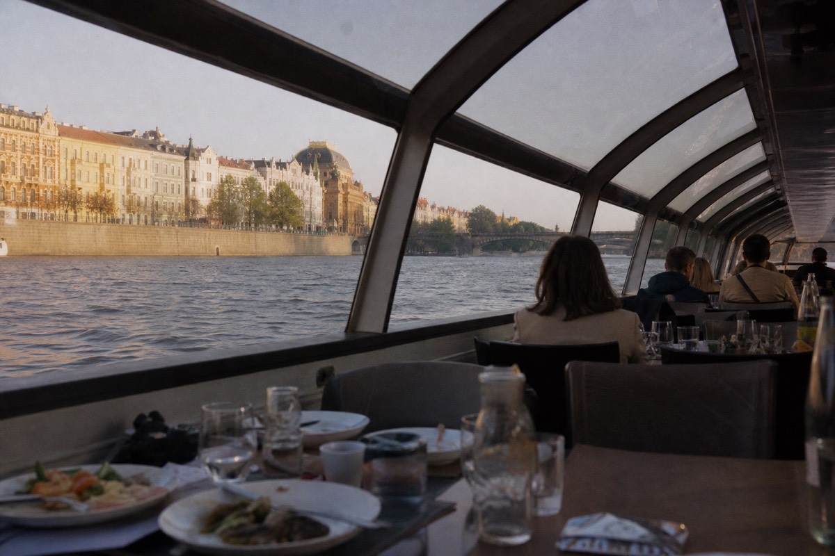 Lunch served on a glass-roofed boat cruising past Prague's riverside