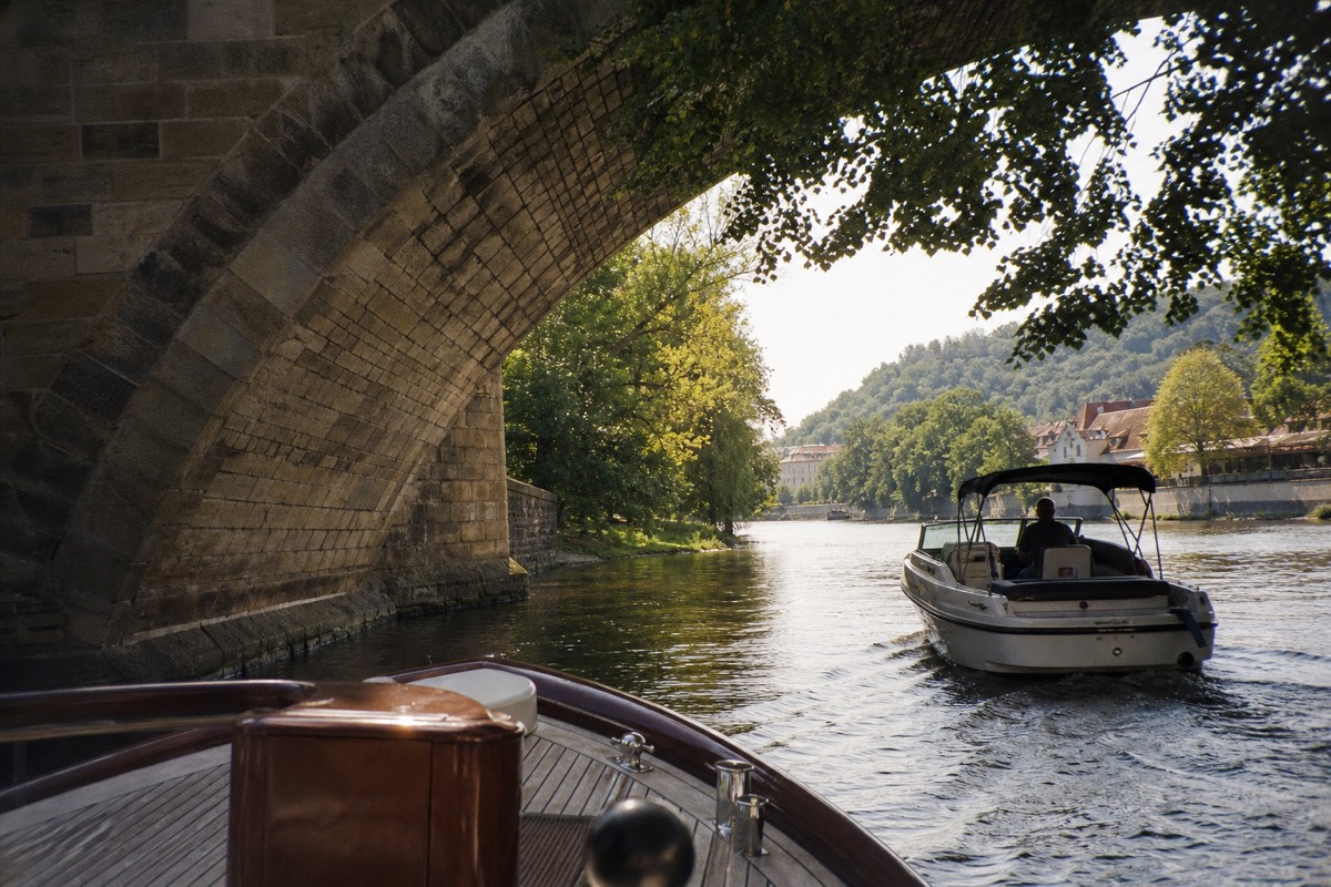 Small private charter boat with its own skipper on the Vltava near Charles Bridge