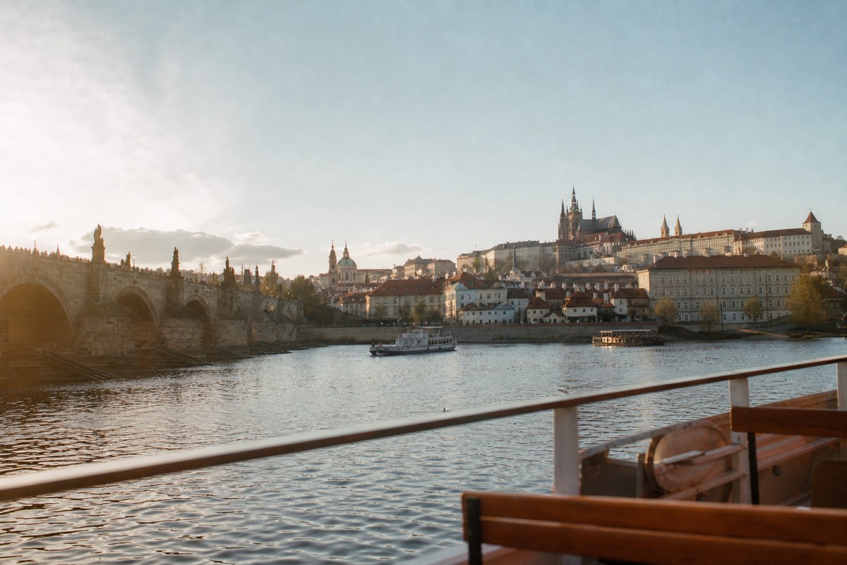 View from a Vltava cruise of Charles Bridge, Prague Castle and the riverside Old Town facades